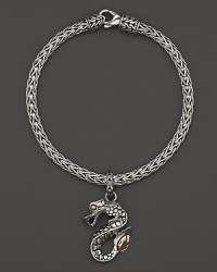 18K yellow gold accents this hand-crafted sterling silver dragon charm bracelet from John Hardy's Naga collection.