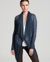 A sheer, ribbed Helmut Lang cardigan is fresh and airy teamed over a tee and coated jeans for a trend-right weekend.