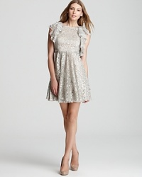 In shimmering metallic lace, BCBGMAXAZRIA's Cynthia dress makes a festive party choice when teamed with dazzling earrings and feminine pumps.