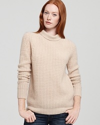 Crafted from luxuriously-soft cashmere with a classic ribbed knit texture, this stylish Theory sweater, updates this timeless turtle with feminine flair.