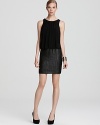 Laser cut dots lend texture to a fitted skirt on Aidan Mattox's blouson-bodiced little black dress.