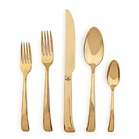 This opulent 5-piece flatware set from Sambonet gets its distinctive polished gold finish through an innovative plating process called physical vapor deposition (PVD). The result is a place setting that is both glamorous and scratch resistant.