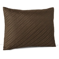 Glinting threads of copper stitched on a diagonal adorn this earthy decorative pillow from Calvin Klein Home.