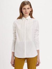 Classic button-down shirt renewed by a notched bib detail, hi-lo hem and silk trim. Point collarButton frontLong sleevesHi-lo hemBody: 95% cotton/5% polyurethane; Contrast: SilkDry cleanImportedModel shown is 5'10 (177cm) wearing US size 2.