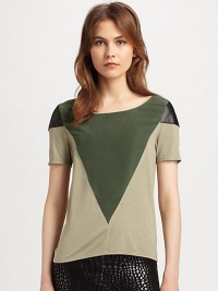 Geometric panels of silk and leather define this lightweight, colorblocked top. BoatneckLeather-trimmed shouldersShort sleevesBody: 60% viscose/25% nylon/15% angora; Contrast: SilkDry clean with leather specialistMade in USA of imported fabricModel shown is 5'9½ (176cm) wearing US size Small.