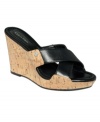 A classy cork wedge. The Evah slide platform sandals by Calvin Klein are so versatile that they'll put a great finishing touch on anything in your closet.