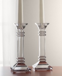 A modern take on a classic design, these crystal candleholders feature sleek lines and sharp, precise edges that converge on a substantial base. In clear lead crystal.