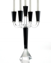 Towering over a room in bold, dramatic fashion, the Sussex candelabra is all you need to redefine the dining table. Five arms of alternating black and clear crystal with sleek, faceted detail require no candlelight to make a magnificent statement. From Lighting by Design.