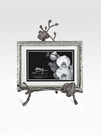 A two-piece easel-style frame finds inspiration in the textures of nature, crafted in hammered and blackened nickel-plated metal by one of America's premier metalwork artists. From the Black Orchid CollectionOverall, 8 X 10½Accommodates a 4 X 6 or 5 X 7 photographImported 