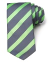 Vibrant green stripes race across a classic silk tie from BOSS Black.