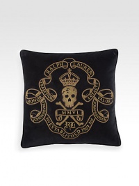 An embroidered skull-and-crossbones motif lends a stylish sense of danger to a plush velvet pillow for a relaxed yet refined aesthetic.22 squareMetal bullion embroideryCotton velvetDry cleanImported