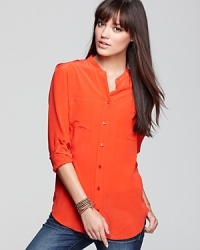 In a collarless cut and cool wash, this sumptuous silk Equipment blouse is a versatile wardrobe essential.