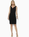 An elegant draped cowl neckline and shirring at the waist lend this sleek dress sophisticated, feminine appeal.