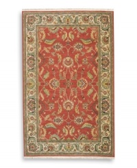 Inspired by the lush tapestries of the 17th-century Mogul dynasty, this classic Agra rug features a scrolling vine design of oversized palmettes and serrated leaves. The green and ivory tones in the palmette border perfectly complement the dynamic color shadings of the rich red ground. Special color treatment creates a gentle finish. Woven of premium worsted New Zealand wool for indulgent softness.