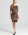 Lead the fashion pack in this Karen Kane dress ablaze with a graphic cheetah print. Tame the style with polished pumps for safari-chic approach to your 9-to-5.