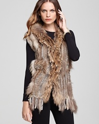 Transition into the new season with a luxe layering piece--slip this plush Shiloh770 fur vest over laid-back looks for instant tribal-chic.