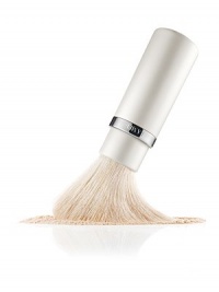 A first-of-its-kind, this sumptuous brush was designed for dual, loose and pressed powder application, providing the ultimate in custom coverage. At first extension, it picks up a generous amount of powder for richer coverage. At full extension, it dusts a fine amount of powder onto the skin, creating sheer coverage. The finest natural hairs glide luxuriously over the skin to create a smooth and even, naturally buffed appearance. Closed: 4¾ Fully extended: 5¼