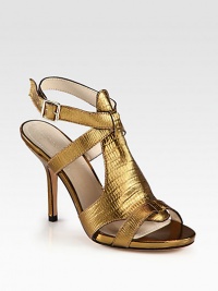 Rippled metallic leather forms this seductive silhouette, with a slender heel and adjustable ankle strap. Self-covered heel, 4 (100mm)Covered platform, ½ (15mm)Compares to a 3½ heel (90mm)Reptile-embossed metallic leather upperAdjustable ankle strapLeather lining and solePadded insoleImported