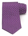 A silk tie adds distinction and flair to your formal presentation. With a repeating pattern of flowers, you'll also punch up your attire with a bit of handsome elegance.