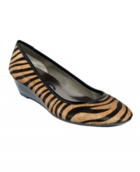 Earn your stripes! A tan-and-black zebra print in haircalf contrasts with a shiny patent leather-covered low wedge heel in the Ester from DKNYC. Show off the striking pattern with simple, solid-colored black pants or a skirt.