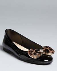 A patent leather heel steps to the fore with a bold leopard jewel bow at the toe.