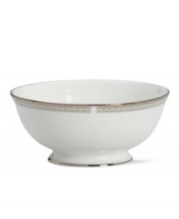 Metropolitan sensibility and modern design combine in this understated white bone china fruit bowl from Lenox's collection of dinnerware and dishes. Platinum gild along the edge is enhanced by a clean, platinum geometric pattern reminiscent of architectural accents.