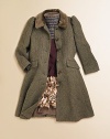 The princess coat in refined wool tweed is tailored for a timeless look with hallmark details in a flattering fit-and-flare silhouette.Round velvet collarLong sleevesButton-frontFlap welt pocketsPrincess seamsFully linedWoolDry cleanImported Please note: Number of buttons may vary depending on size ordered. 