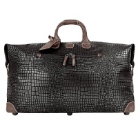 This classically styled crocodile-embossed luggage with leather trim provides the perfect pieces for any stylish traveler on the go.