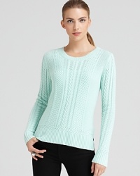 Invite this classically-cabled, soft-as-cashmere BCBGMAXAZRIA sweater into your cold-weather collection.