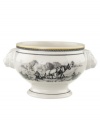 Depicting a classic pastoral scene in premium porcelain, this grand Audun bowl coordinates beautifully with the entire Audun country dinnerware collection from Villeroy & Boch. Handles shaped like a lion's head add a regal touch.