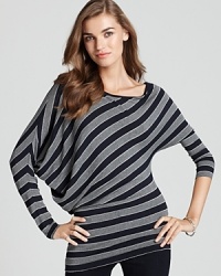 Asymmetrical stripes embrace a timeless trend and lend a modern edge to this tunic-style Bailey 44 top.