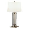 Table lamp with full range dimmer switch. Clear glass cylinder with dark antique nickel accents. Off white cotton shade with rolled edge hem.