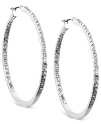 A shining statement. Anne Klein's large hoop earrings are crafted from silver-tone mixed metal with glass crystal accents adding a glistening and glamorous touch. Approximate diameter: 1-3/4 inches.