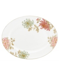 Perennial favorite. Beautiful vintage blooms on the gold-banded Painted Camellia oval platter grace your table with the dramatic, yet refined, elegance of Marchesa by Lenox.