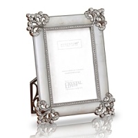 Give your pictures the attention they deserve. This spectacular genuine mother of pearl frame is encrusted with handset Swarovski crystals in a fleur de lis corner pattern. An additional inset of studded crystals adds a luxurious touch.