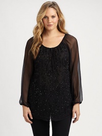 You will certainly sparkle in this chiffon top with a feminine neckline and sequin-adorned front.Drawstring necklineLong sleevesSequin frontCurved hemPull-on styleAbout 30 from shoulder to hemSilkDry cleanImported