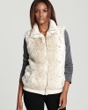 On days when you can skip a coat, slip on this ultra cozy Ellen Tracy vest for layered warmth on the go. Soft rib knit trim and faux fur enrich this must-have vest for your cold weather wardrobe.