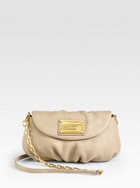 A convertible silhouette of soft and slouchy leather with a chic chain and leather strap.Removable shoulder strap, 23 dropMagnetic flap closureSix credit card slotsOne inside open pocketFully lined9W X 5½H X 3/4DImported