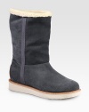 Ultra-cozy suede essential lined in shearling with grosgrain ribbon trim. Rubber heel, 1 (25mm)Shaft, 9¼Leg circumference, 13Pull-on styleSuede upper with grosgrain ribbon trimShearling liningRubber solePadded insoleMade in Italy