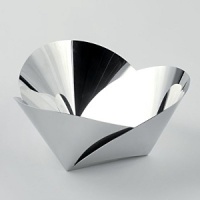 This one-of-a-kind basket designed by Abi Alice blends age-old geometric forms with state-of-the-art techniques. Laser-cut to exacting dimensions then folded into elegant forms, the piece suggests the lightness and delicacy of an origami paper creation while being expertly crafted from mirror polished stainless steel.