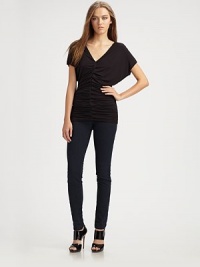 Luxe jersey skims the body in a softly-ruched V-neck.Dropped shouldersShort sleevesCenter ruchingAbout 28 from shoulder to hem94% rayon/6% spandexDry cleanMade in USA