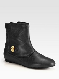 A gleaming goldtone skull adds signature style to this ultra-soft leather ankle boot. Leather upperPull-on styleLeather lining and solePadded insoleMade in Italy