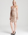 In a classic nude hue, Sue Wong's strapless dress lends elegance with allover embellishments.