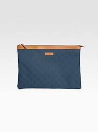 Nylon Guccissima trimmed with leather in a zip-top pouch.Top zip closureFully lined12W X 8½H X 1/4DMade in Italy