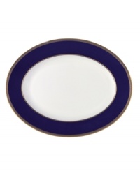 Embellished with intricate garlands, oval links and a fanciful dragon motif, this Wedgwood dinnerware evokes Europe's glorious Renaissance period. Rendered in deep blue and gold to transform any formal meal into a spectacular royal gala.