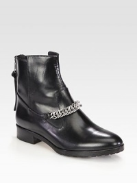 Street-ready kicks made of sumptuous leather and topped with a gleaming metal chain. Stacked heel, 1 (25mm)Leather upper with metal chain detailBack zipLeather liningRubber solePadded insoleImported