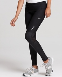 These workout-ready Nike leggings feature cooling mesh panels, reflective trim and Dri-FIT technology to wick away moisture.