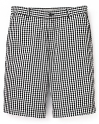 Classic gingham dresses up a timeless pair of flat front shorts from Michael Kors.