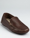 Moc toe loafer crafted in pebbled Italian leather and accented with contrast topstitching.