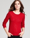 Gleaming rhinestones scattered throughout embellish every inch of this red hot Alice + Olivia sweater.